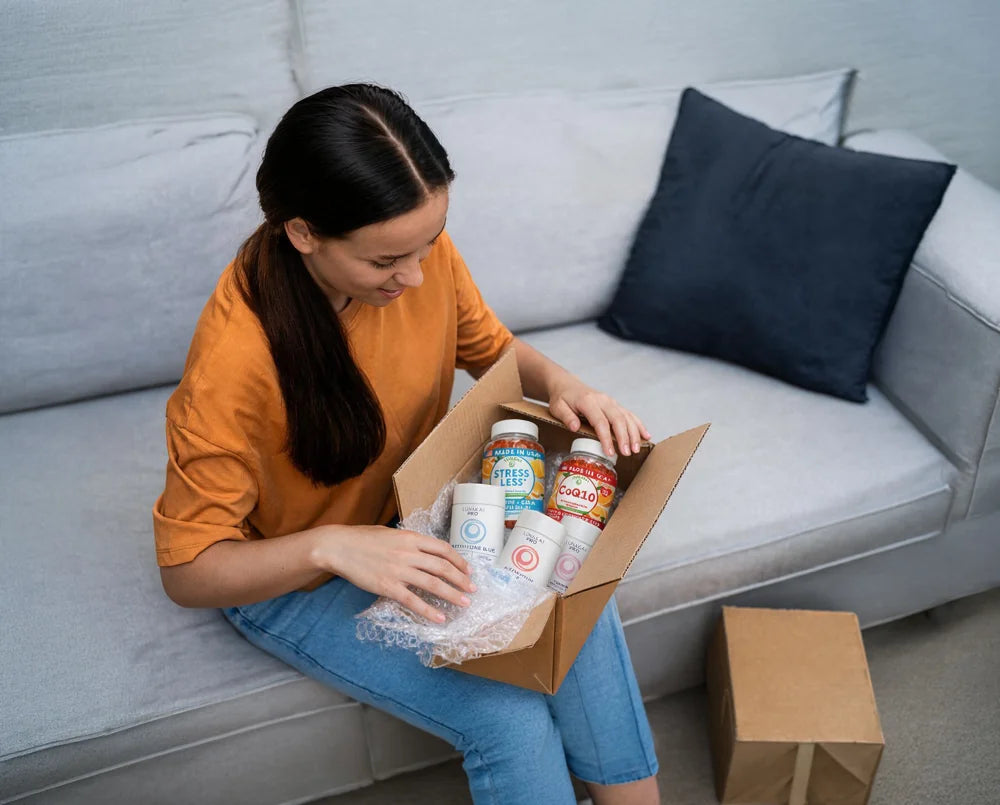 Woman unboxing Lunakai supplements